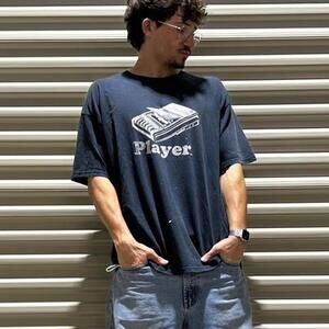 Vintage 90s faded and distressed Steve and Barry’s “player” shirt